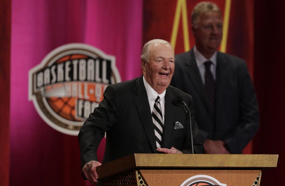 FILE - Former basketball head coach Bob "Slick" Leonard smiles as he addresses a gathering during his enshrinement ceremony for the Basketball Hall of Fame in Springfield, Mass., in this Friday, Aug. 8, 2014, file photo. Leonard, the former NBA player and Hall of Fame coach who won three ABA championships with the Indiana Pacers and spent more than a half century with the organization, has died. He was 88. His death was announced by the Pacers on Tuesday, April 13, 2021. (AP Photo/Charles Krupa, File)