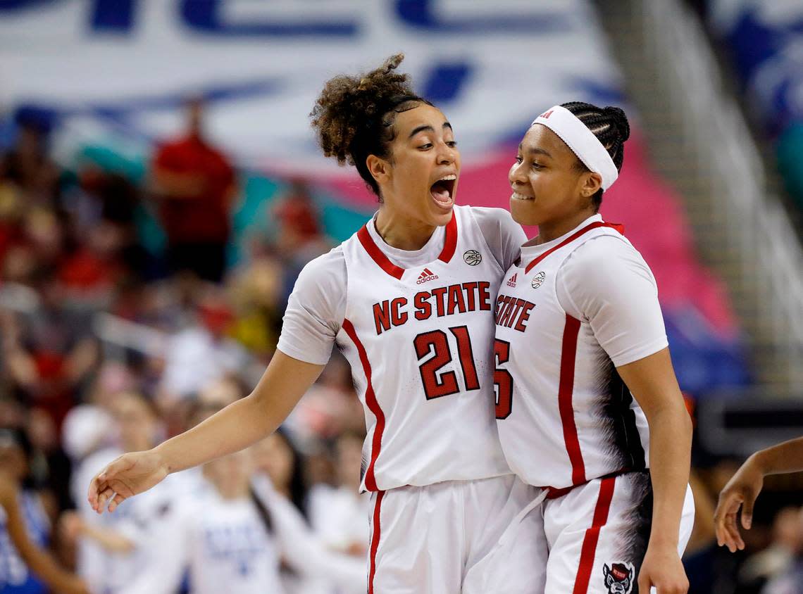 N.C. State’s Zoe Brooks (35) is congratulated by teammate Madison Hayes after knocking down a basket to give the Wolfpack a five point lead with less than a minute remaining in the second half of an ACC Tournament quarterfinal game against Duke on Friday, March 8, 2024, at Greensboro Coliseum in Greensboro, N.C. Kaitlin McKeown/kmckeown@newsobserver.com