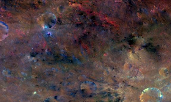 The northwest region of Vesta's crater Sextilia (at the bottom right of this image) reveals material likely carried in by an impact (black), as well as material that was probably created by melting (red).