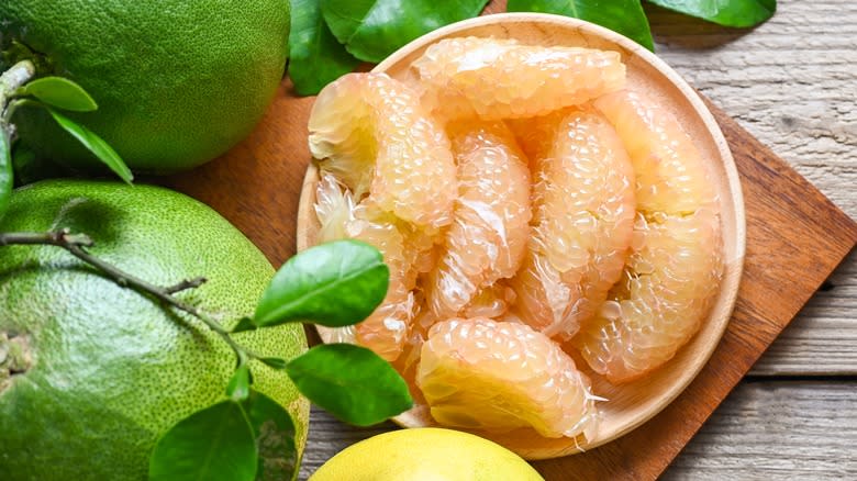 Close up of pomelo sections in bowl