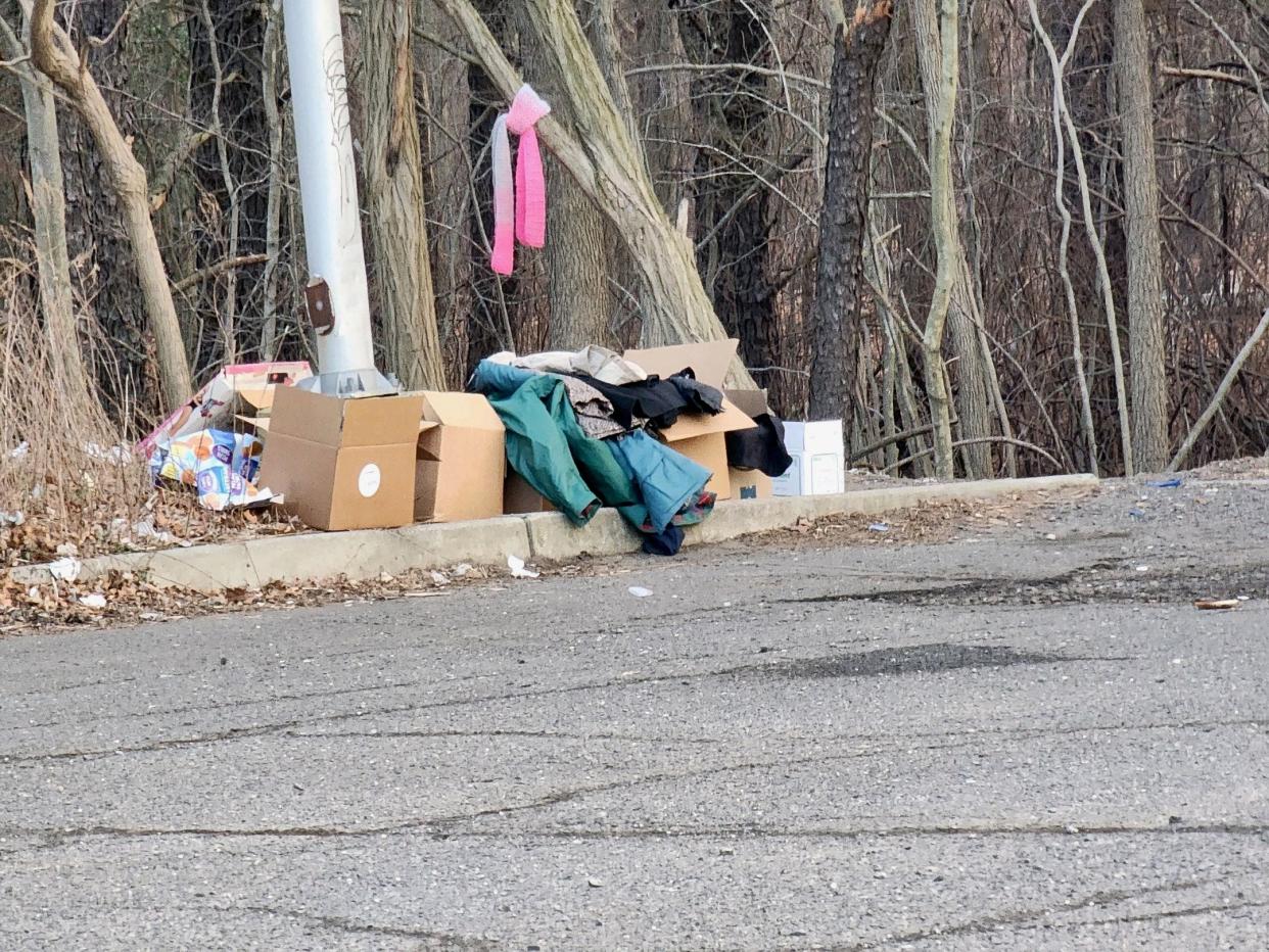 Boxes left on the curb near the homeless encampment