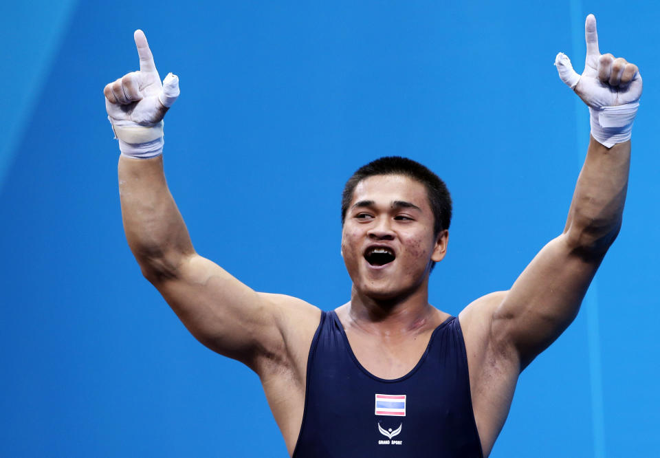 LONDON, ENGLAND - AUGUST 01: Chatuphum Chinnawong of Thailand reacts while competing in the Men's 77kg Weightlifting on Day 5 of the London 2012 Olympic Games at ExCeL on August 1, 2012 in London, England. (Photo by Jeff Gross/Getty Images)