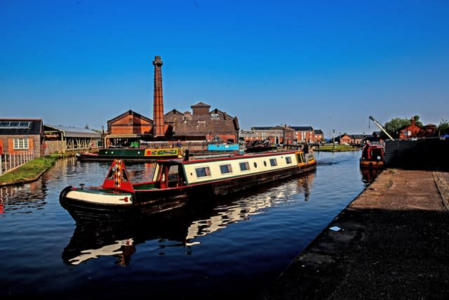 A canal boat leaves the Ellesmere Port Boat Museum after the Easter Boat Gathering