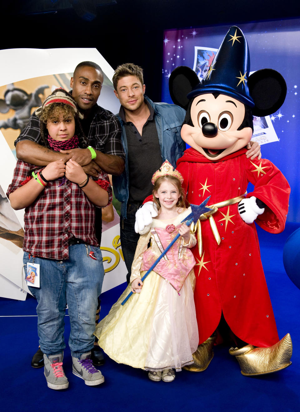 Simon Webb and his daughter Alanah and Duncan James and his daughter Tianie enjoy the Magical Moments Festival at Disneyland, Paris.
