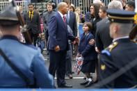 Massachusetts Governor Deval Patrick (C) joins the family of Boston Marathon bombing victim Martin Richard at the finish line for a wreath-laying ceremony in Boston, Massachusetts April 15, 2014. Richard's family members include sister Jane (3rd R), mother Denise (2nd R) and brother Henry (R). REUTERS/Brian Snyder (UNITED STATES - Tags: SPORT ATHLETICS DISASTER ANNIVERSARY POLITICS)