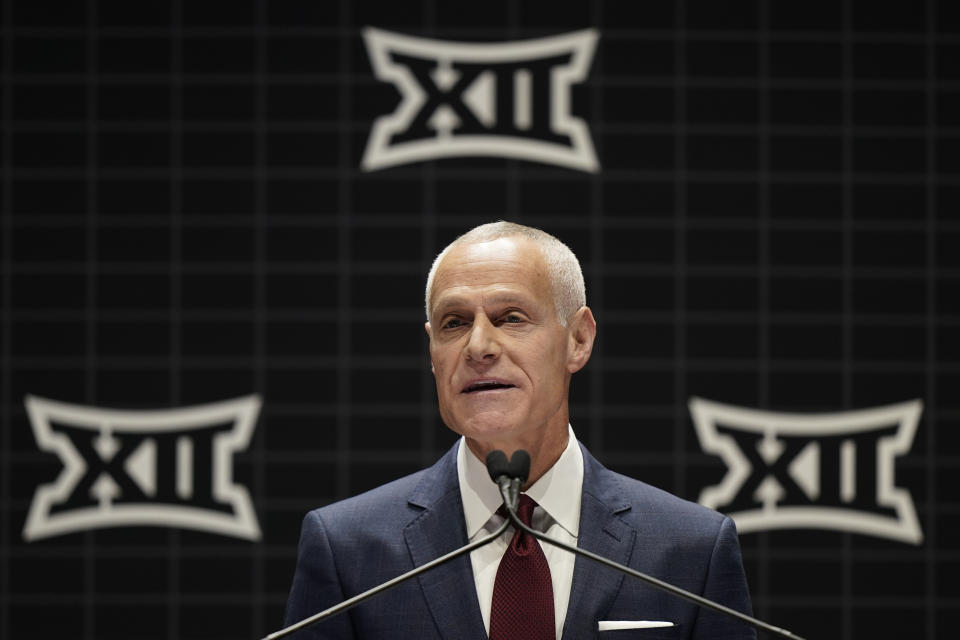 Big 12 commissioner Brett Yormark addresses the media during the NCAA college Big 12 women's basketball media day Tuesday, Oct. 17, 2023, in Kansas City, Mo. The NCAA and the nation's five biggest conferences have agreed to pay nearly $2.8 billion to settle a host of antitrust claims,a monumental decision that sets the stage for a groundbreaking revenue-sharing model that could start directing millions of dollars directly to athletes as soon as the 2025 fall semester.(AP Photo/Charlie Riedel, File)