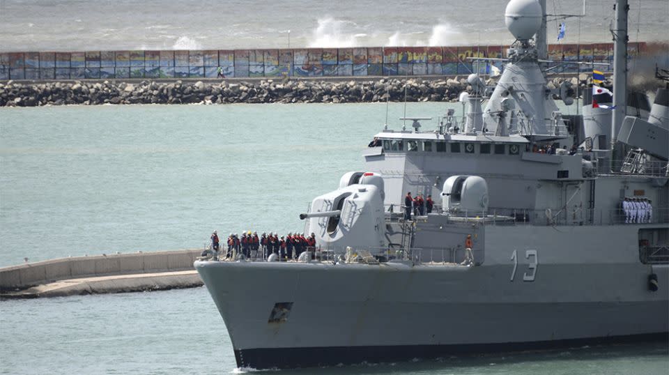 A ship leaves a naval base to join the search for missing submarine. Source: AAP