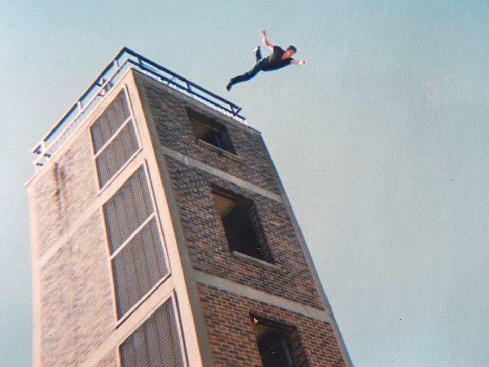 Steen Young falling from a building.