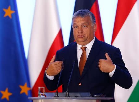 Hungary's Prime Minister Viktor Orban speaks during a news conference in Warsaw, Poland, August 26, 2016. REUTERS/Kacper Pempel