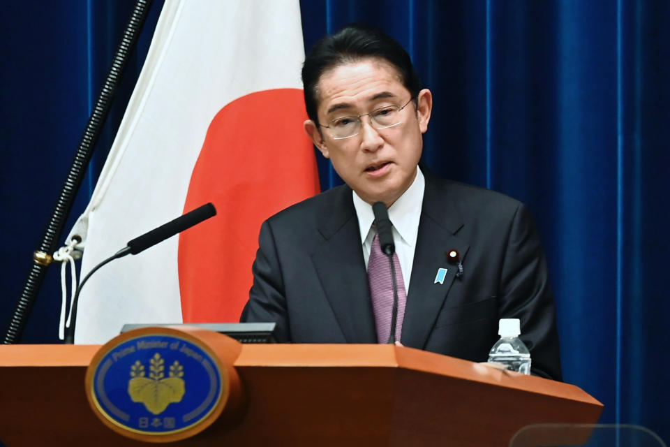 FILE - Japan's Prime Minister Fumio Kishida speaks during a news conference at the prime minister's official residence in Tokyo on Dec. 16, 2022. Kishida announced Tuesday, Dec. 27, that Japan will tighten border controls against COVID-19 by requiring tests for all visitors from China starting Friday as a temporary emergency measure against the surging infections there. (David Mareuil/Pool Photo via AP, File)