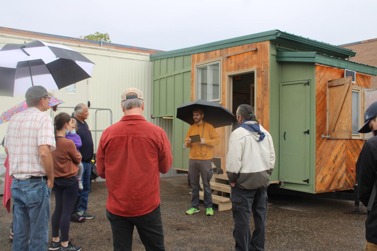 James MacKenzie speaks to community leaders and media about how the tiny home he built and donated to the American Indian Community Development Corporation in Minneapolis. (Photo by Darren Thompson for Native News Online)