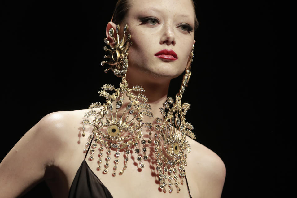 A model wears a creation for Schiaparelli's Haute Couture Fall/Winter 2022-2023 fashion collection, Monday, July 4, 2022 in Paris. (AP Photo/Lewis Joly)