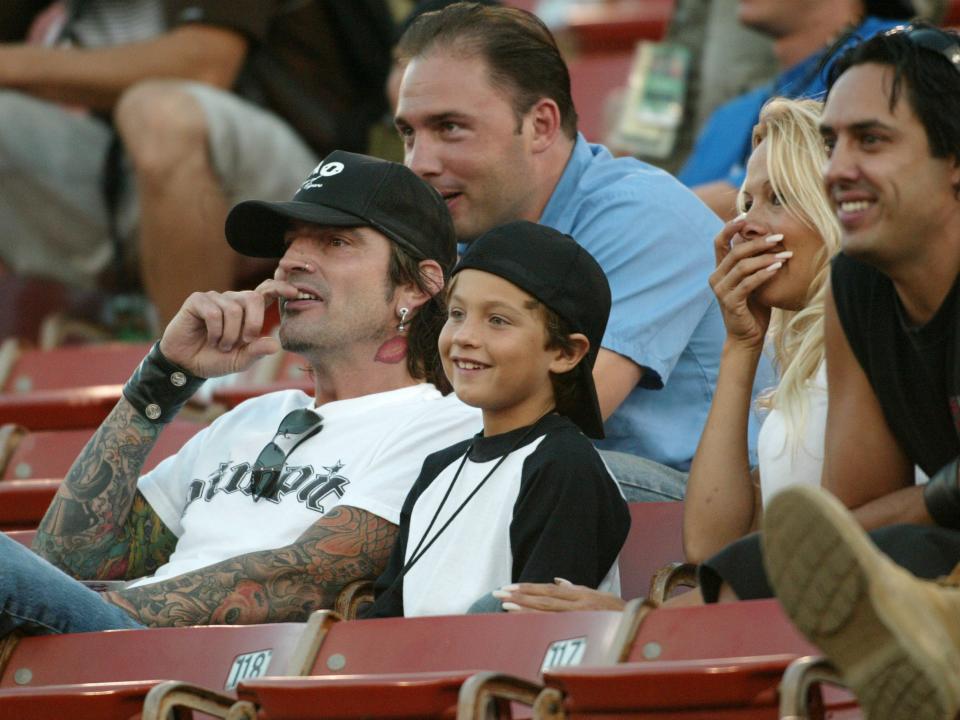 Pamela Anderson,Tommy Lee and 2 children Brandon Thomas and Dylan Jagger watch the X Games - Moto X Freestyle competition at the AL Coliseum in Los Angeles, Calif. on Saturday August 16, 2003.