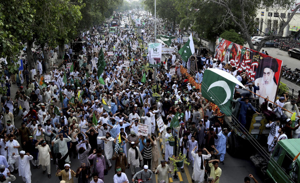 Supporters of Pakistani Islamic radical party rally against India in Lahore, Pakistan, Friday, Aug. 9, 2019. Thousands of activists held peaceful rallies across Pakistan to condemn India and its decisions on Kashmir. (AP Photo/K.M. Chaudhry)