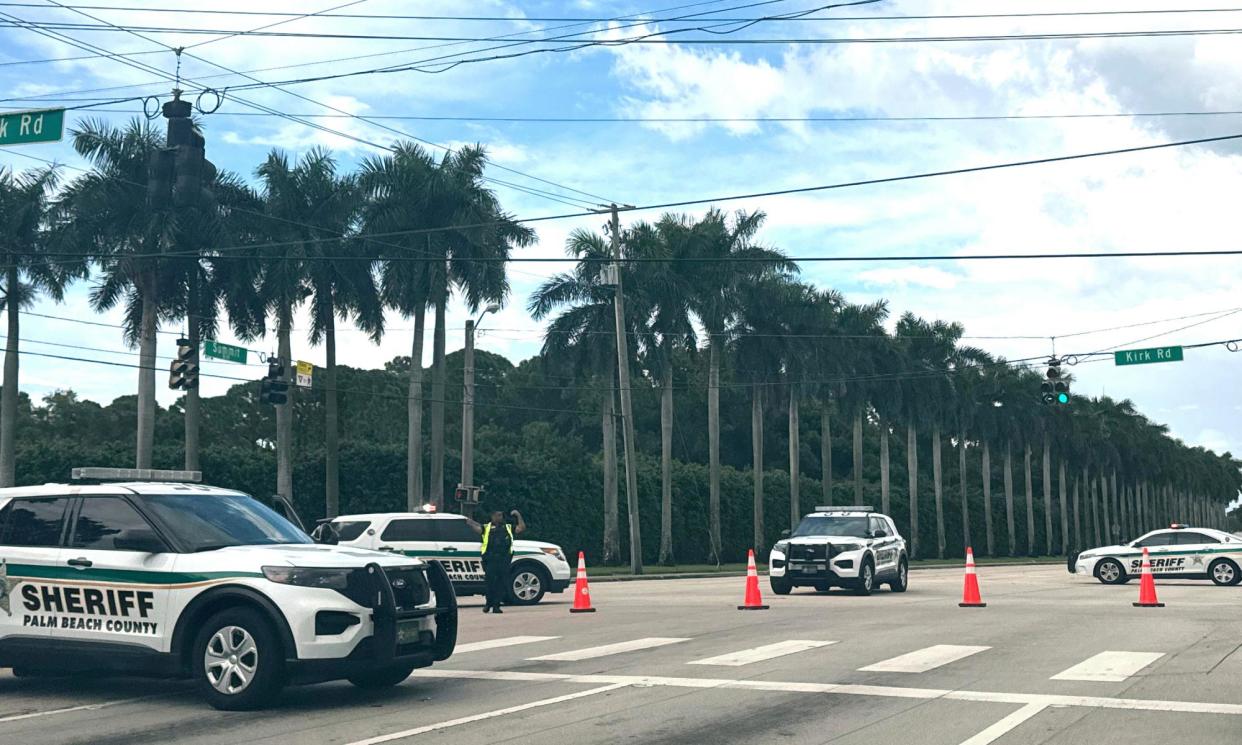 <span>Sheriff vehicles are pictured near Trump International Golf Club on Sunday after gunshots were reported.</span><span>Photograph: Stephanie Matat/AP</span>