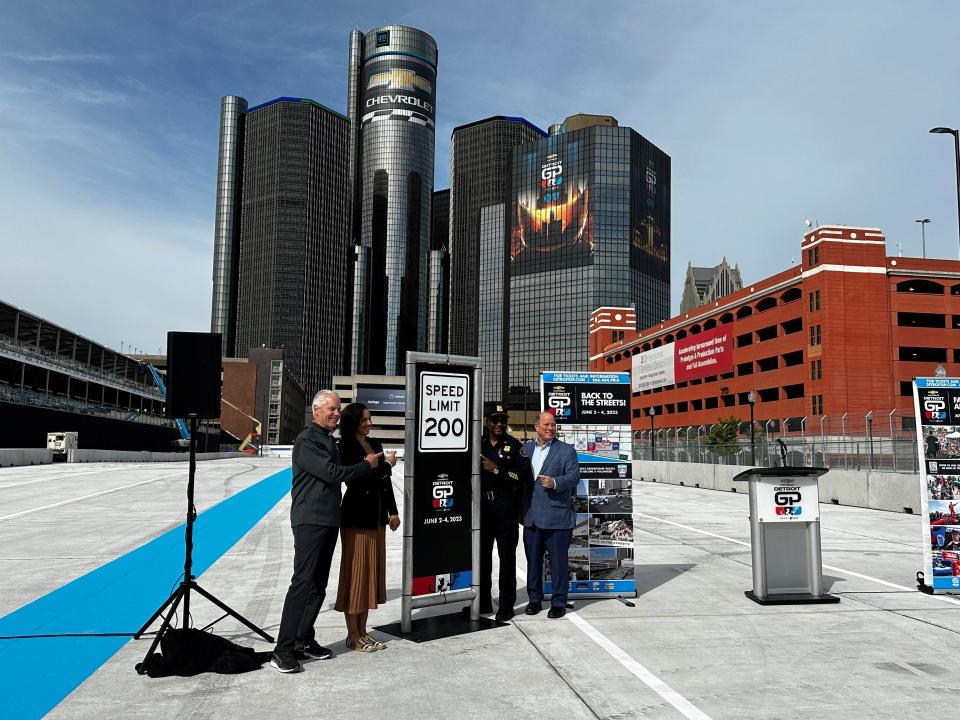 Grand Prix chairman Bud Denker, left, Council President Mary Sheffield, Detroit Police Chief James White and Mayor Mike Duggan point to the speed limit sign for race cars in the 2023 Detroit Grand Prix.