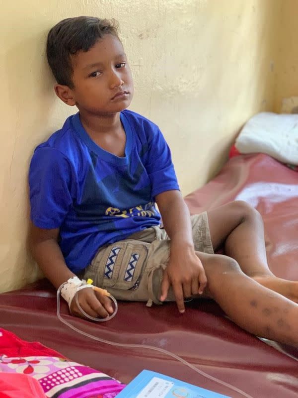 A boy sits in the pediatrics ward at Kampong Speu District Referral Hospital in Krong Chbar Mon