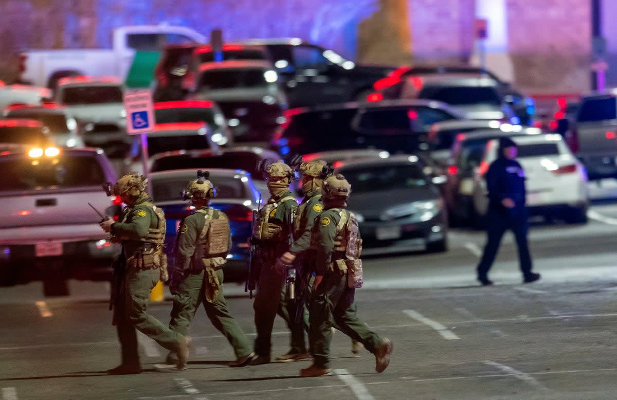 File: Law enforcement agents walk in the parking lot of a shopping mall, Wednesday, Feb. 15, 2023, in El Paso, Texas (AP)