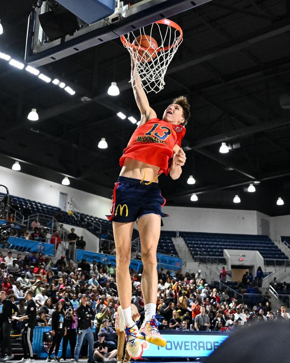 McDonald's All American East guard Matas Buzelis (13) dunks the ball during the Powerade Jam Fest at Delmar Athletic Complex.
