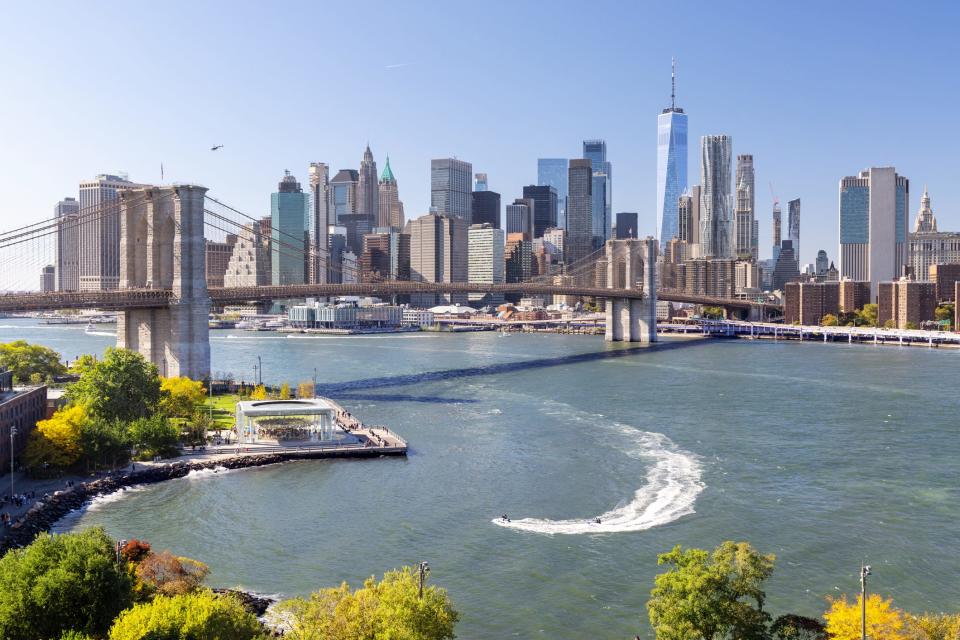 New York City skyline includes Manhattan Skyscrapers panorama and Brooklyn Bridge