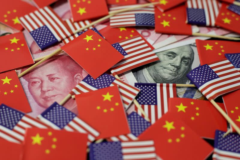 FILE PHOTO: FILE PHOTO: Illustration picture showing U.S. dollar and China's yuan banknotes