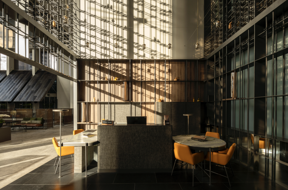 The reception with a feature wall casting shadows (Photo: Pan Pacific Orchard)