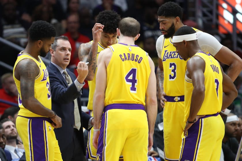 Lakers coach Frank Vogel talks with his team during a game against the Pelicans on Nov. 27 at Smoothie King Center.