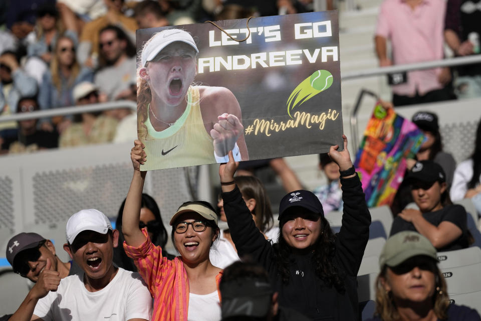 Supporters of Mirra Andreeva of Russia react during her fourth round match against Barbora Krejcikova of the Czech Republic at the Australian Open tennis championships at Melbourne Park, Melbourne, Australia, Sunday, Jan. 21, 2024. (AP Photo/Alessandra Tarantino)