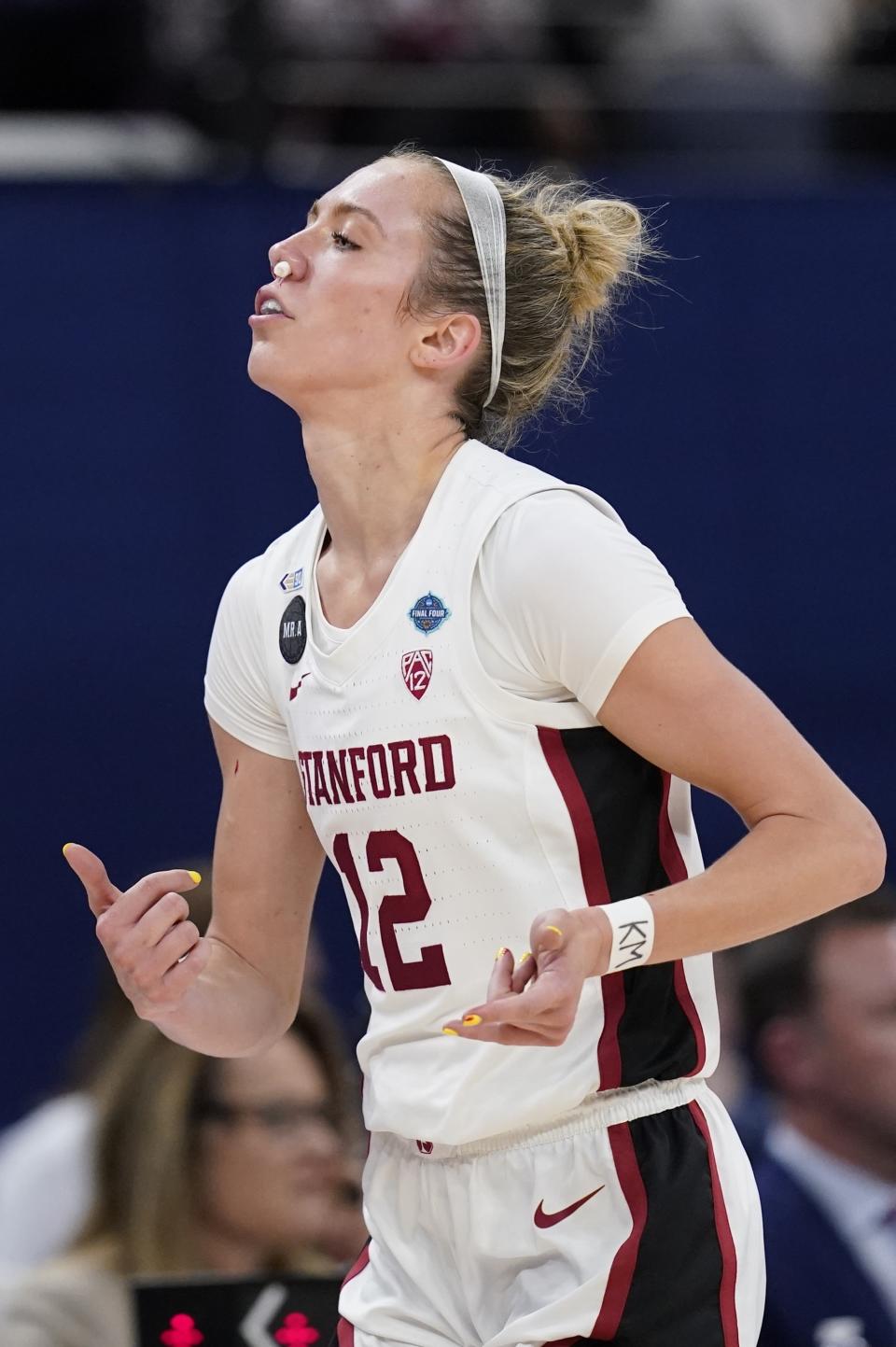 Stanford's Lexie Hull is seen with a nose plug after getting a bloody nose during the first half of a college basketball game in the semifinal round of the Women's Final Four NCAA tournament Friday, April 1, 2022, in Minneapolis. (AP Photo/Charlie Neibergall)