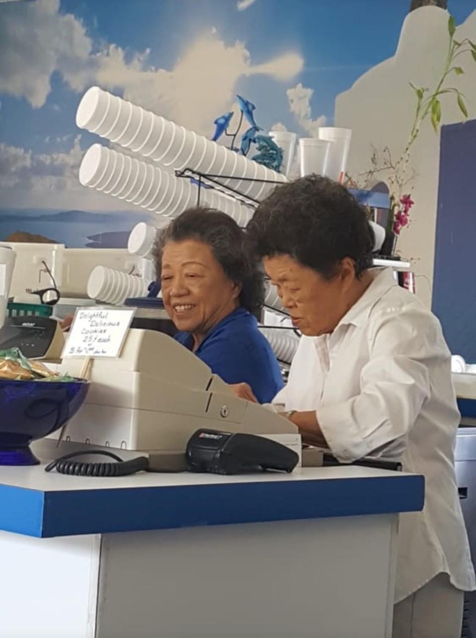 Betsy Yee and her sister Violet Toy working the counter of Blue Fin in 2016.