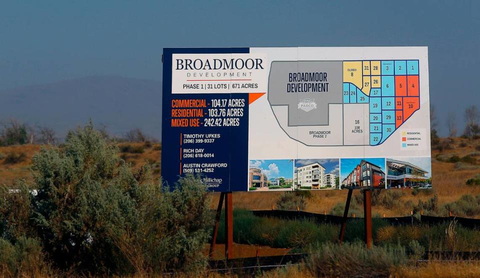 A sign posted along Broadmoor Boulevard outlines the residential and retail development plan for the west Pasco area.