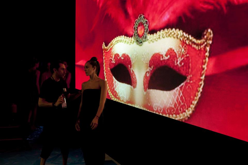 In this April 9, 2013 photo, a model practices prior to the show by Peru's designer Jimena Mujica during Lima Fashion Week in Lima, Peru. The shows are highlighting the work of 16 Peruvian designers of clothes, jewelry and accessories as well as the collection of Spanish designer Agatha Ruiz de la Prada, who was invited as a special participant. (AP Photo/Martin Mejia)