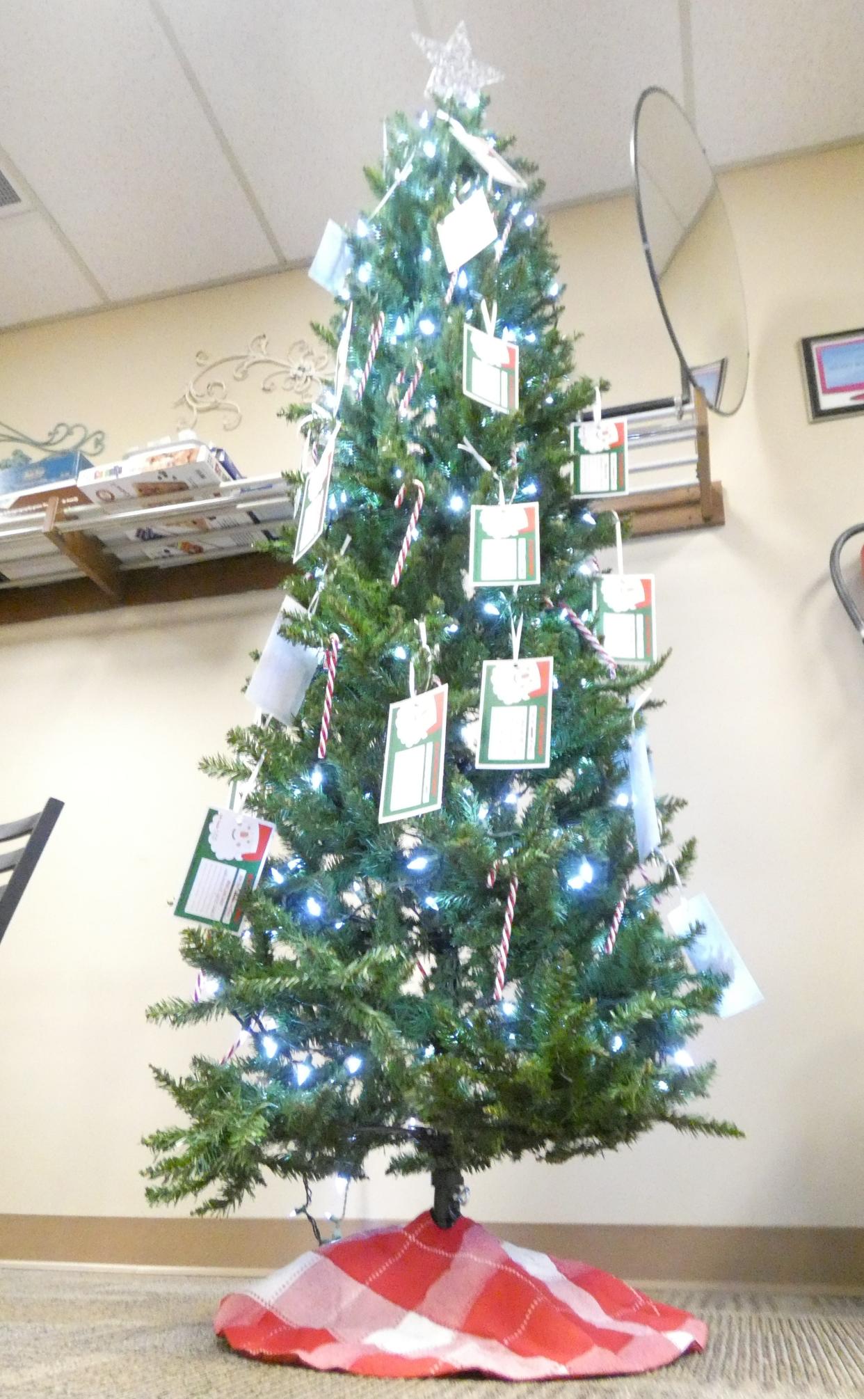 A Secret Santa tree stands in the lobby of the Crawford County Council on Aging, 200 S. Spring St.