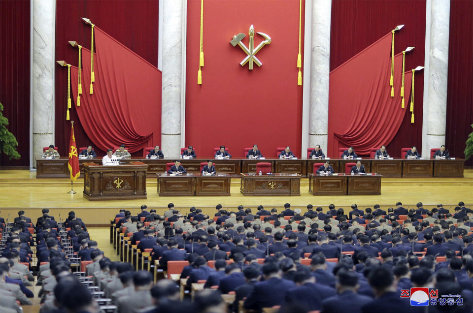 In this Sunday, Dec. 29, 2019, photo provided Monday, Dec. 30, by the North Korean government, North Korean leader Kim Jong Un, in white, left, speaks during a Workers’ Party meeting in Pyongyang, North Korea. North Korea opened Saturday, Dec. 28, a high-profile political conference to discuss how to overcome “harsh trials and difficulties," state media reported Sunday, days before a year-end deadline set by Pyongyang for Washington to make concessions in nuclear negotiations. Independent journalists were not given access to cover the event depicted in this image distributed by the North Korean government. The content of this image is as provided and cannot be independently verified. Korean language watermark on image as provided by source reads: "KCNA" which is the abbreviation for Korean Central News Agency. (Korean Central News Agency/Korea News Service via AP)