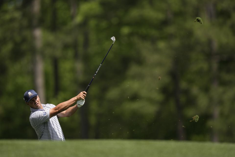 Bryson DeChambeau watches his tee shot on the 12th hole during the first round at the Masters golf tournament at Augusta National Golf Club Thursday, April 11, 2024, in Augusta, Ga. (AP Photo/Charlie Riedel)