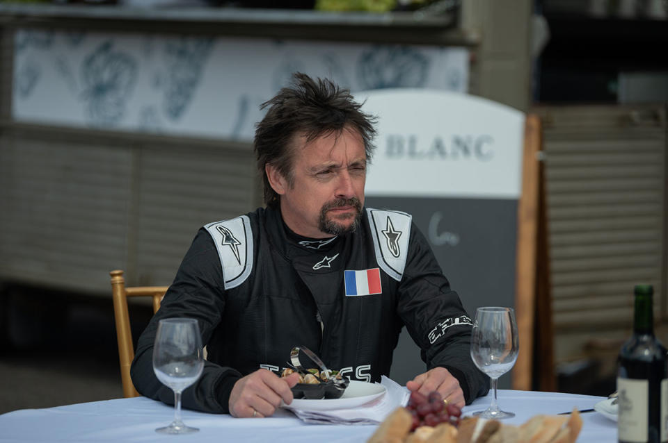 Richard Hammond wearing a black racing jumpsuit in The Grand Tour Presents: Carnage A Trois. Photo: Amazon Prime Video (supplied).