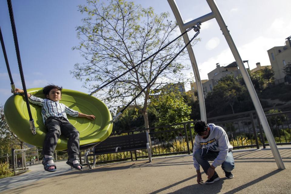 Mojib Khan enjoys a trip to a nearby park with his elder brother Zabih Khan.