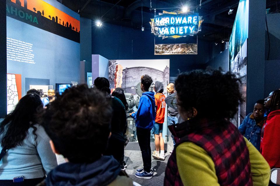 Guests walk through the "Realizing the Dream," a tour of the African American exhibit at the Oklahoma History Center in Oklahoma City on Saturday, Feb. 11, 2023.