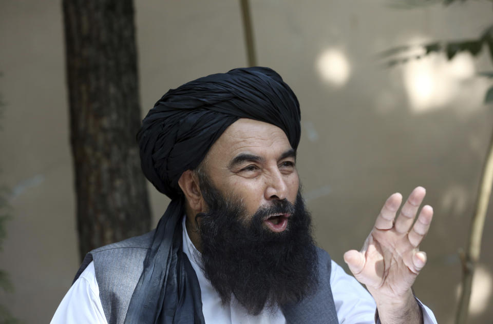 CORRECTS NAME SPELLING - In this Thursday, Aug. 29, 2019, photo, a former Taliban military leader Syed Akbar Agha speaks during an interview with the Associated Press in Kabul, Afghanistan. Agha defended the recent beatings, saying the peace movement gives the impression the insurgent group doesn't want the war to end. (AP Photo/Rahmat Gul)