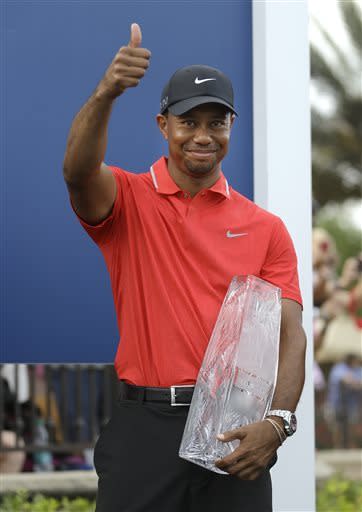 Tiger Woods gives a thumbs-up after winning The Players Championship. (AP)