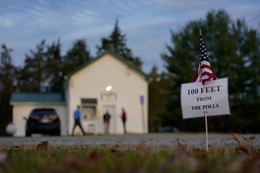 A sign is posted outside a polling location in the Washington Township House in Oregonia, Ohio, Tuesday, Nov. 7, 2023, as people arrive to vote. Polls are open in a few states for off-year elections that could give hints of voter sentiment ahead of next year’s critical presidential contest. (AP Photo/Carolyn Kaster)