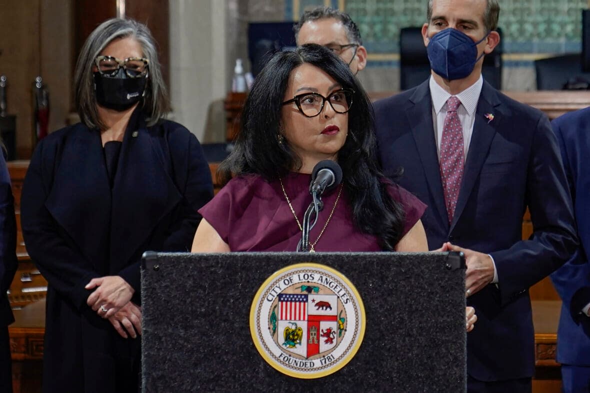 Los Angeles City Council President Nury Martinez, center, speaks at a news conference at Los Angeles City Hall on April 1, 2022. Los Angeles detectives are investigating whether a recording last year that captured city councilmembers’ racist remarks was made illegally, the police chief said Tuesday, Oct. 25. (AP Photo/Damian Dovarganes, File)