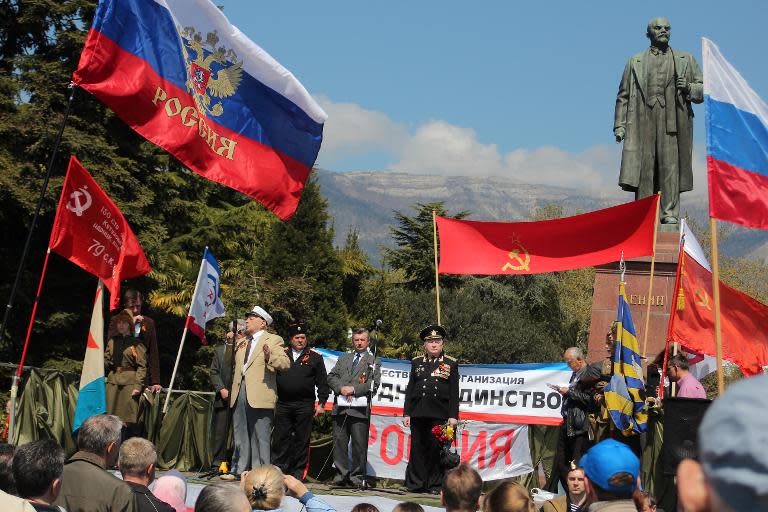 Crimean residents attend a rally near Lenin's monument in central Yalta, on April 16, 2014, as they celebrate the 70th anniversary of the peninsula's liberation from Nazi Germany troops in 1944