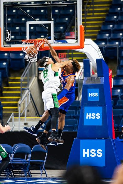 Miles McBride #5 of the Westchester Knicks dunks the ball against the Maine Celtics on November 29, 2021 at Webster Bank Arena in Bridgeport, Connecticut.