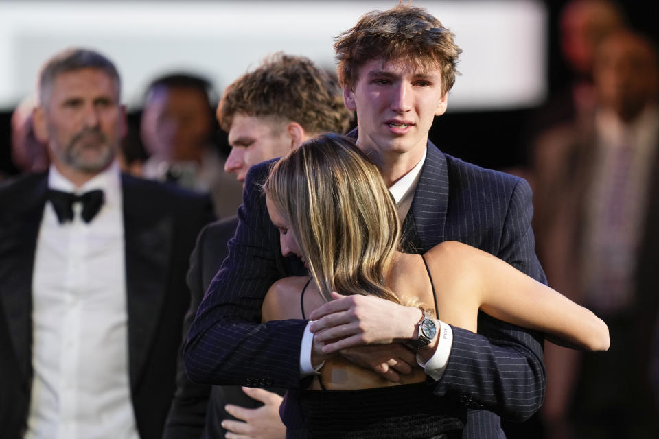 Matas Buzelis hugs family and friends after being selected by the Chicago Bulls as the 11th pick during the first round of the NBA basketball draft, Wednesday, June 26, 2024, in New York. (AP Photo/Julia Nikhinson)