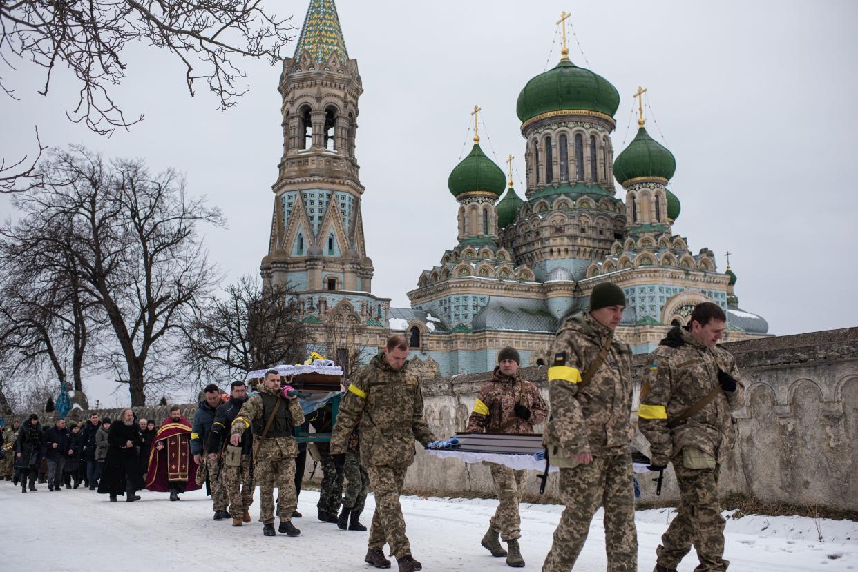 Ukrainian soldiers are carrying the body of Denys Hrynchuk from Hrynchuk family's house to the church in Bila Krynytsia, on March 6, 2022, in Chernivtsi region, Ukraine. Denys Hrynchuk served in the Ukrainian army. He was killed on Feb. 28, 2022, near Volnovakha, Donetsk region. He is survived by his mother, five brothers and a sister, his wife and his one-year-old son.