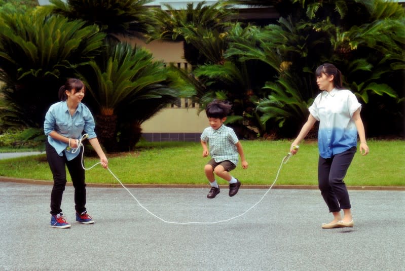 FILE PHOTO: Japan's Prince Hisahito jumps rope with his sisters Princess Mako and Princess Kako at their residence in Tokyo