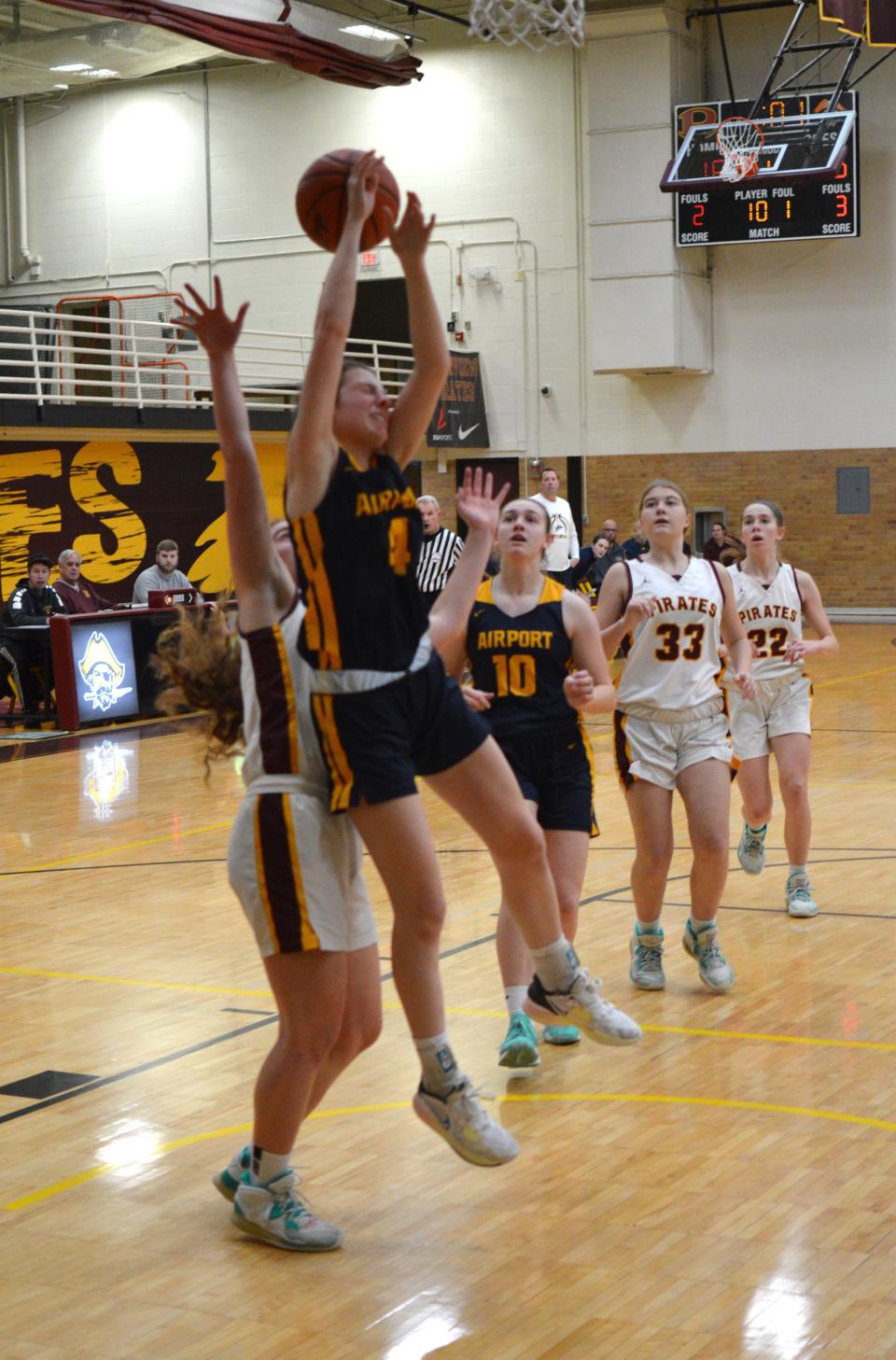 Airport's Jillian Baker is fouled as she drives for a shot against Riverview on Thursday, Jan. 26, 2023.