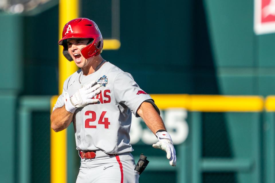 Jun 22, 2022; Omaha, NE, USA; Arkansas Razorbacks center fielder Braydon Webb (24) celebrates after hitting a double against the Ole Miss Rebels during the first inning at Charles Schwab Field. Mandatory Credit: Dylan Widger-USA TODAY Sports