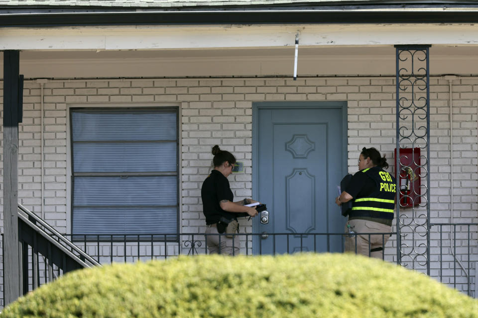 Georgia Bureau of Investigation (GBI) officers go door to door at the Cielo Azulak Apartments, Friday, Feb. 23, 2024, in Athens, Ga. Police said Friday that they are questioning a “person of interest” in the death of a nursing student whose body was found on the University of Georgia campus after not returning from a run.(Jason Getz/Atlanta Journal-Constitution via AP)